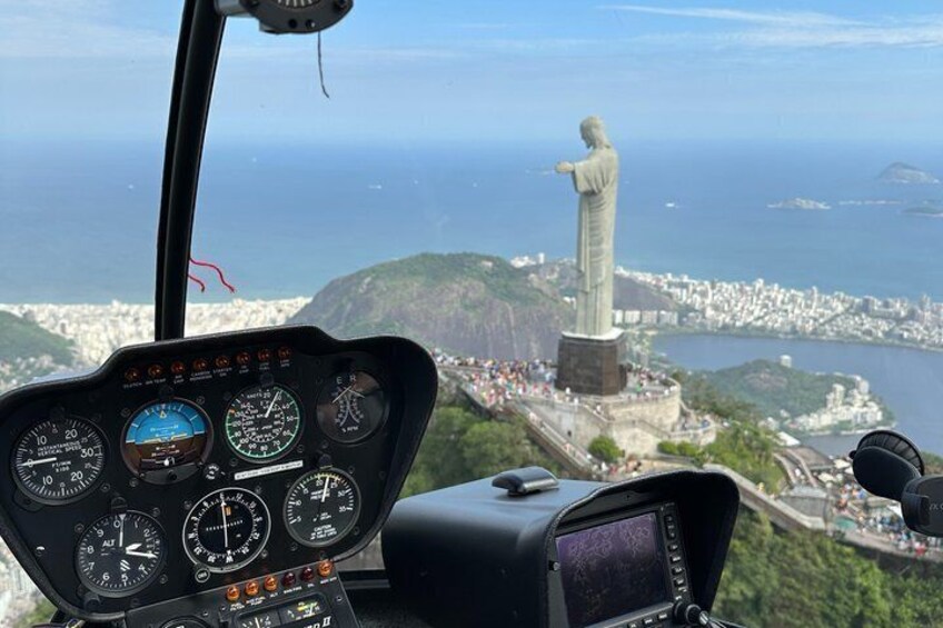 A helicopter cockpit with a view of the Christ the Redeemer statue in Rio de Janeiro. 3