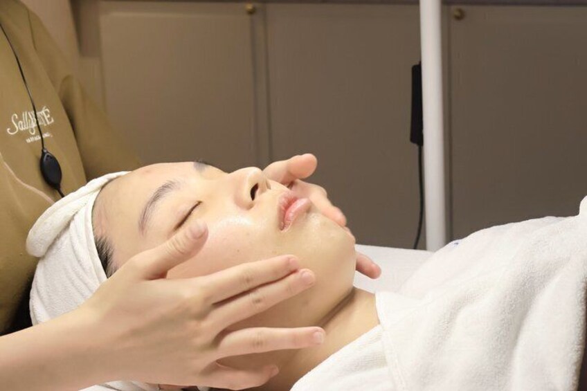 A person receiving a facial treatment. 1