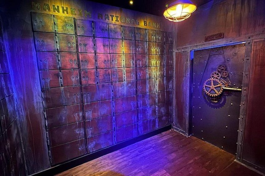 A room with lockers, a wooden floor, and a door with a lock mechanism. 2