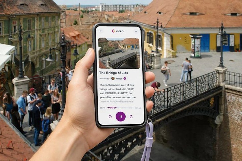 A smartphone displaying a historical bridge with a crowd in the background. 1