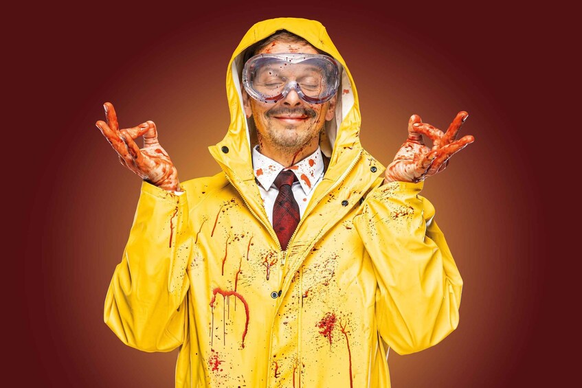 A person in a yellow raincoat with blood splatters. 1