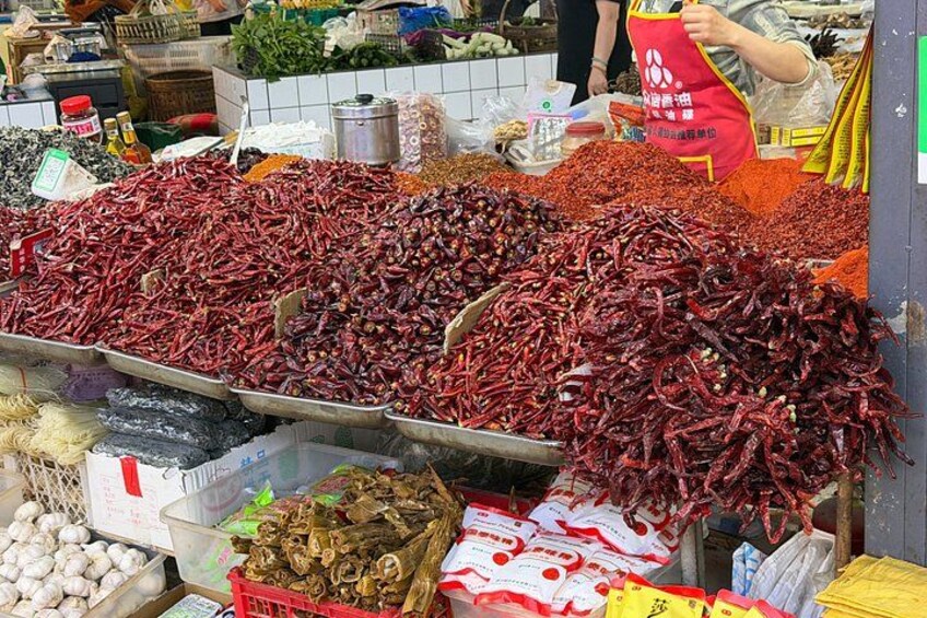 A market stall with dried chilies and other spices. 4