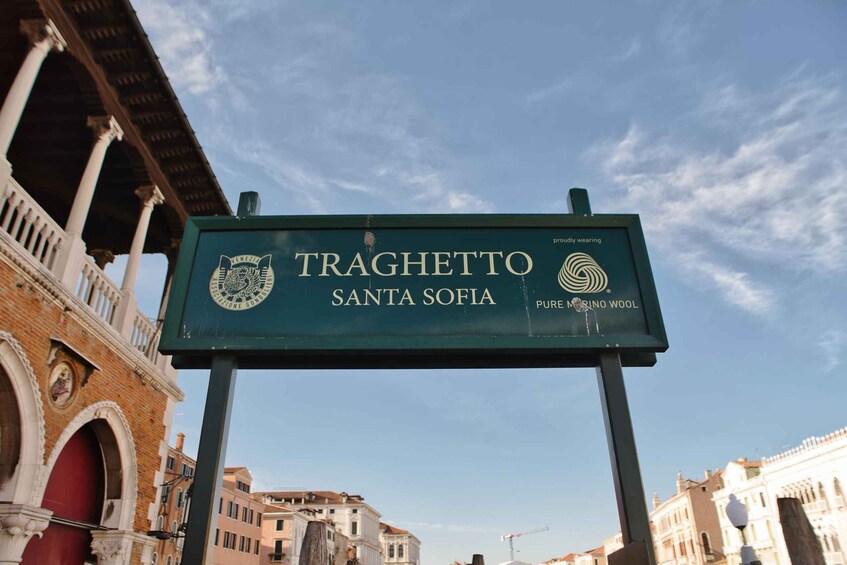 A sign for Traghetto Santa Sofia with a logo and text. 3