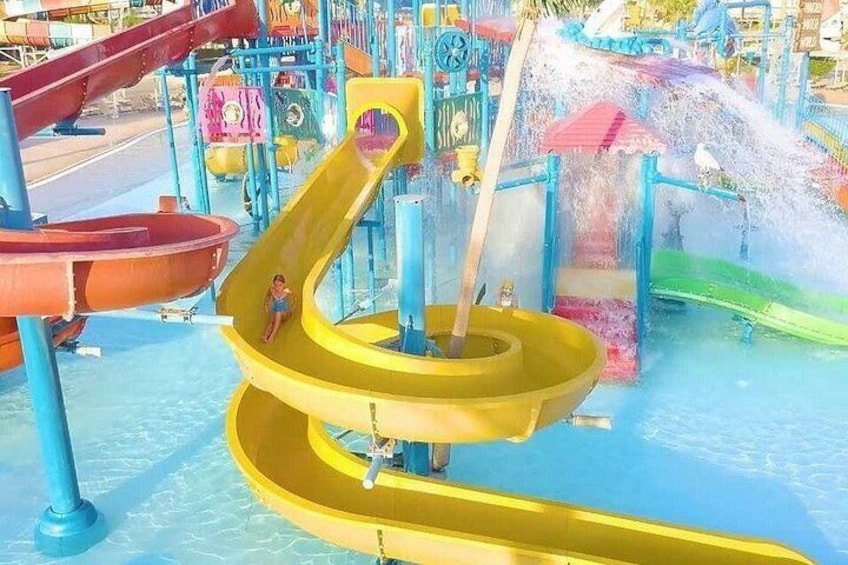 A water park with multiple slides and water features. 2
