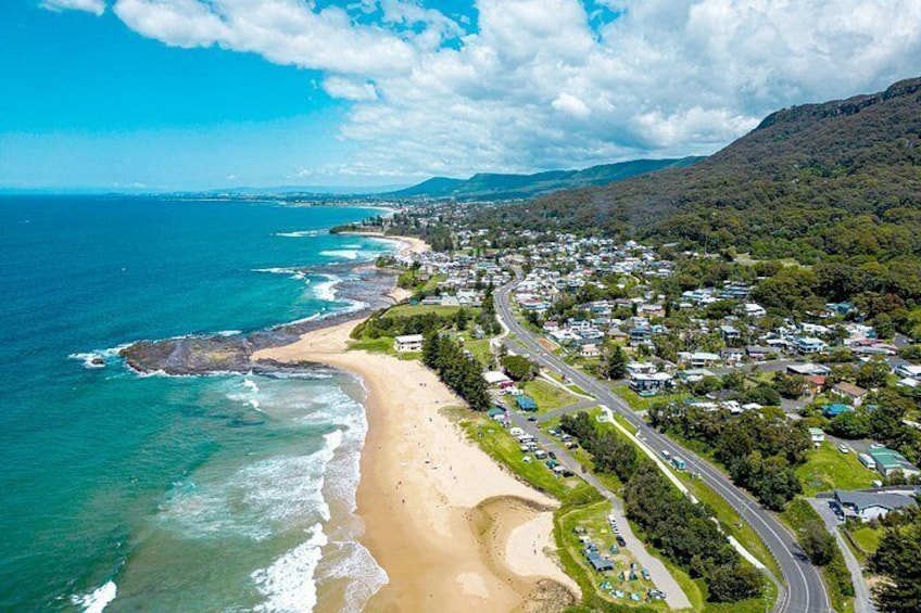 A coastal town with a beach, roads, and residential areas. 5