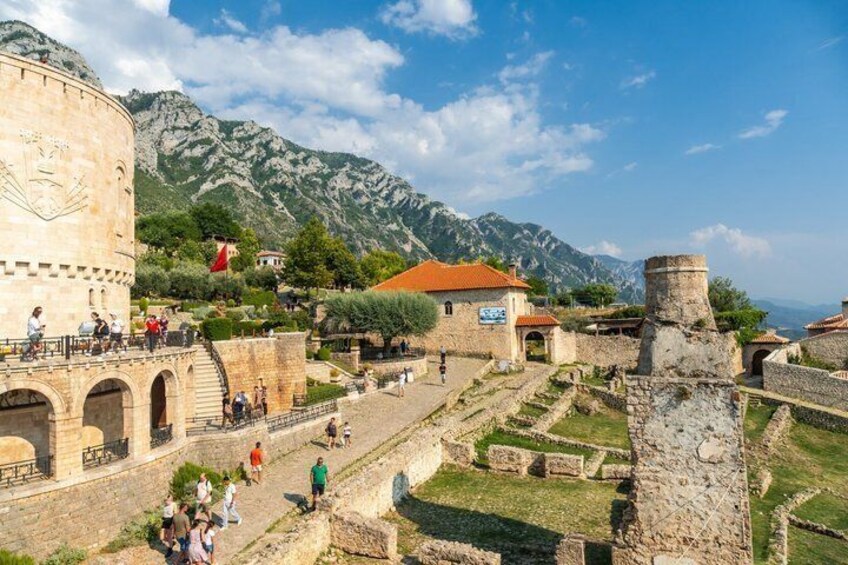 Ancient ruins, a stone tower, and a mountainous backdrop. 3