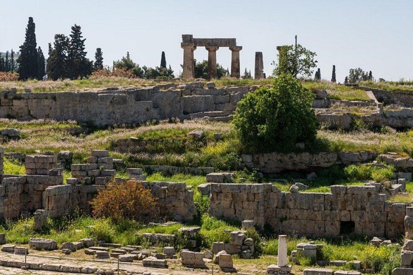 Ancient ruins with stone columns and scattered stone blocks. 5