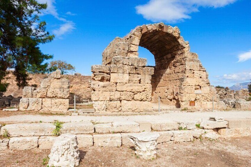 Ancient ruins with a large stone archway. 5