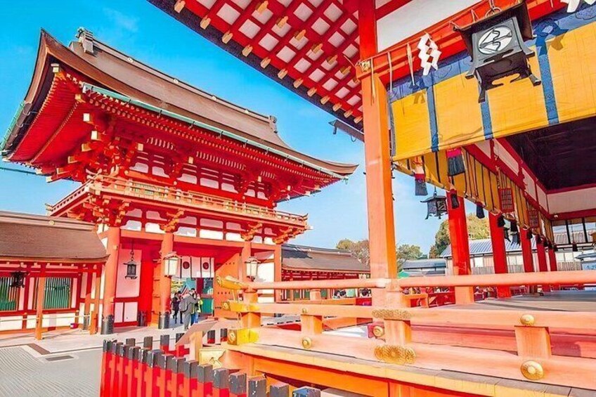 A traditional Japanese building with a red roof and wooden beams. 4