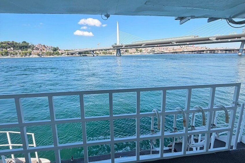 A bridge, water, and a railing. 2