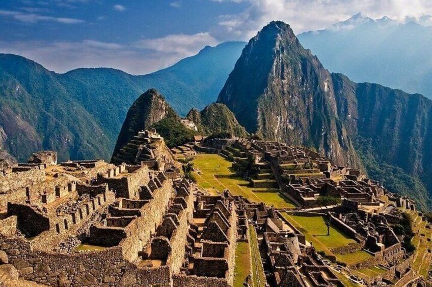 Machu Picchu ruins with Inca architecture and Huayna Picchu mountain in the background. 3