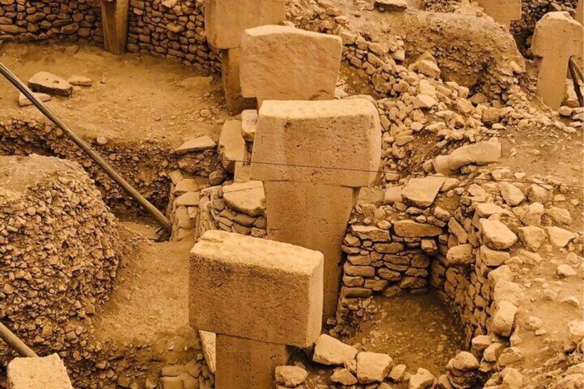 Ancient stone ruins with large blocks and stone walls. 1