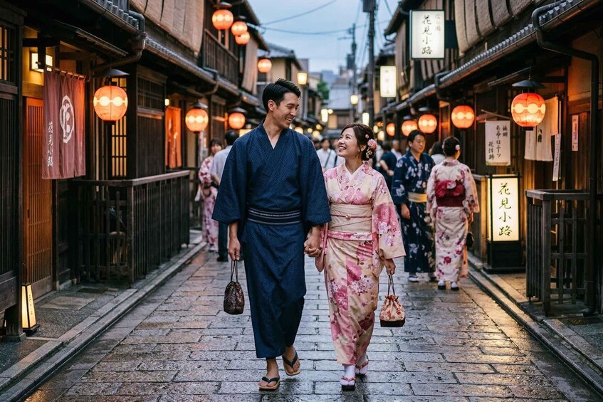 A traditional street with wooden buildings, hanging lanterns, and people in traditional attire. 1