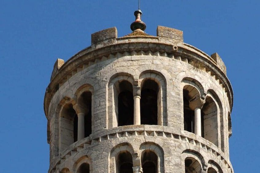 A round tower with arched windows and a dome on top. 5