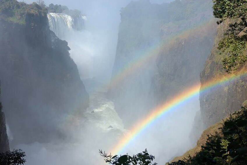 A waterfall with a rainbow. 4
