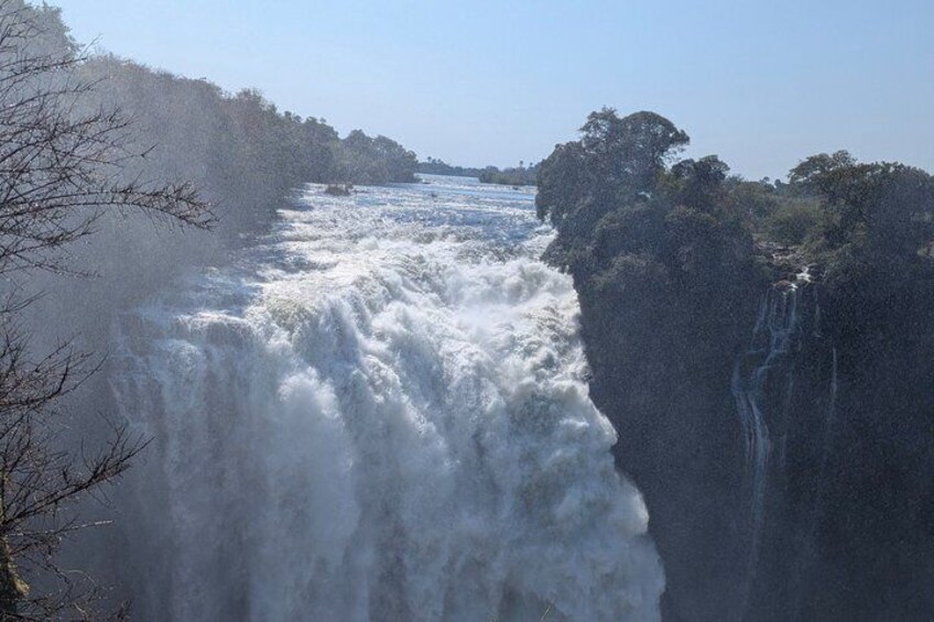 A large waterfall cascading down a rocky cliff. 3
