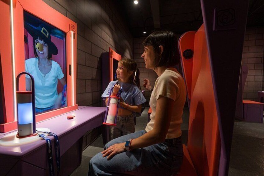 A person using a virtual reality headset in a room with red and purple furniture. 2