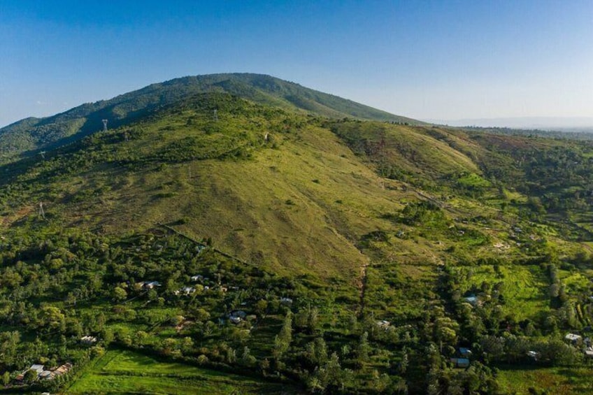 A mountainous landscape with a village at its base. 5