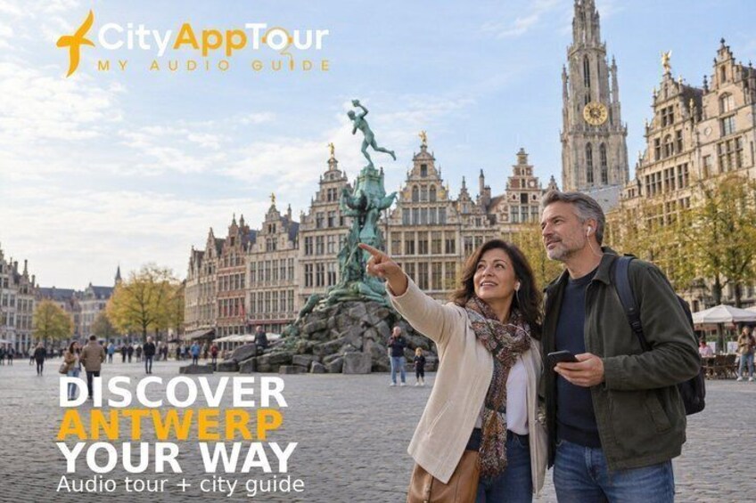 A couple taking a selfie in a historic square with a statue and buildings in the background. 1