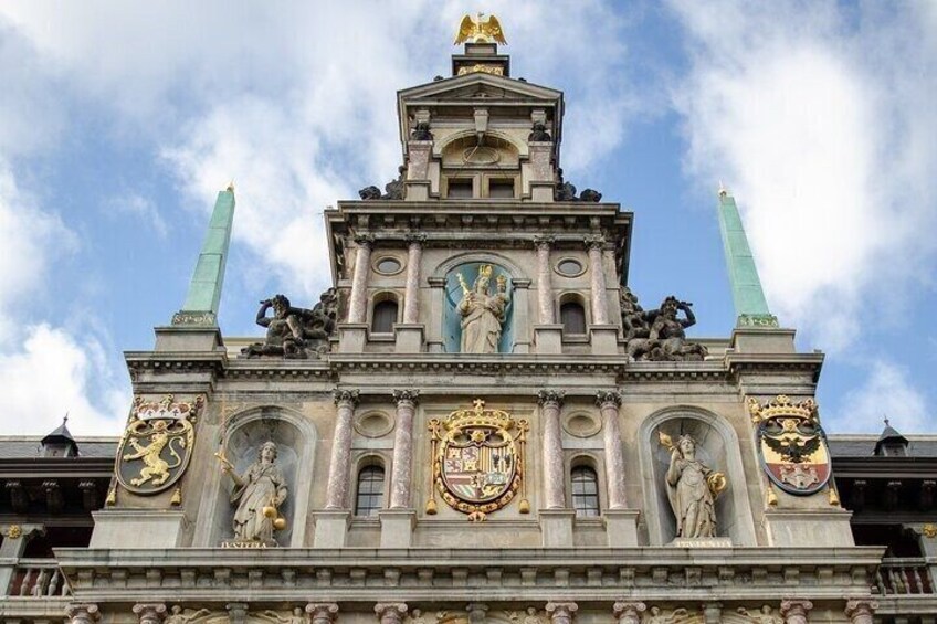 A grand building with ornate sculptures and a prominent clock tower. 5