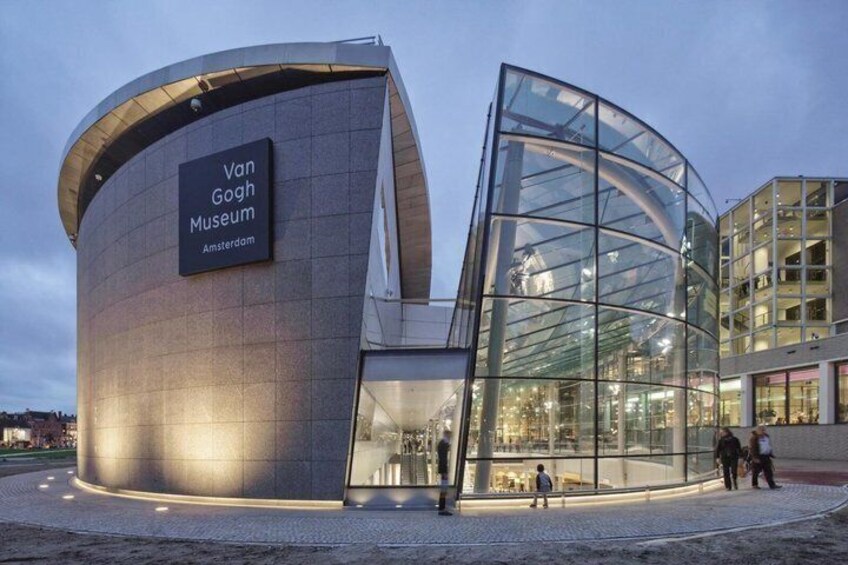 The Van Gogh Museum in Amsterdam with a distinctive curved glass facade. 2