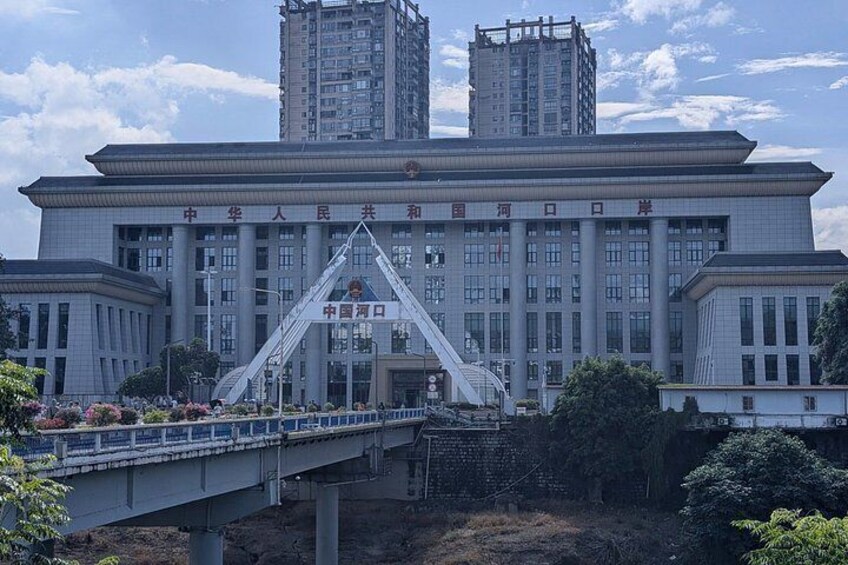 A large government building with a bridge in front. 4