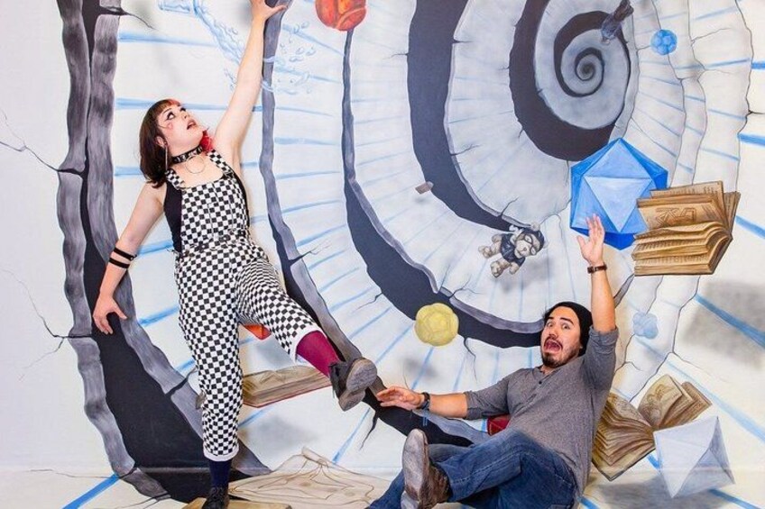 A person in a checkered dress reaching for a basketball, another person sitting with books, and a spiral staircase in the background. 4