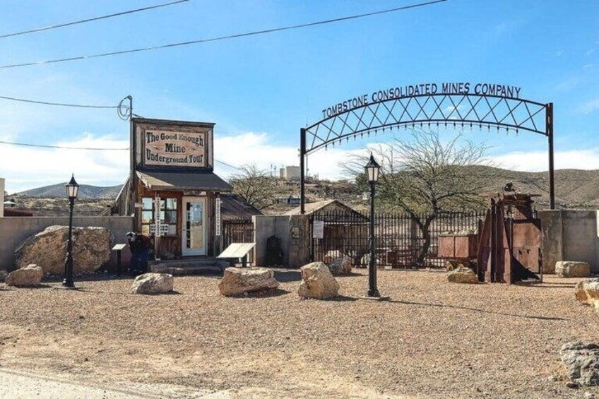 A sign for 'The Good Enough Mine Underground Tour' and a gate labeled 'Tombstone Consolidated Mines Company.' 4