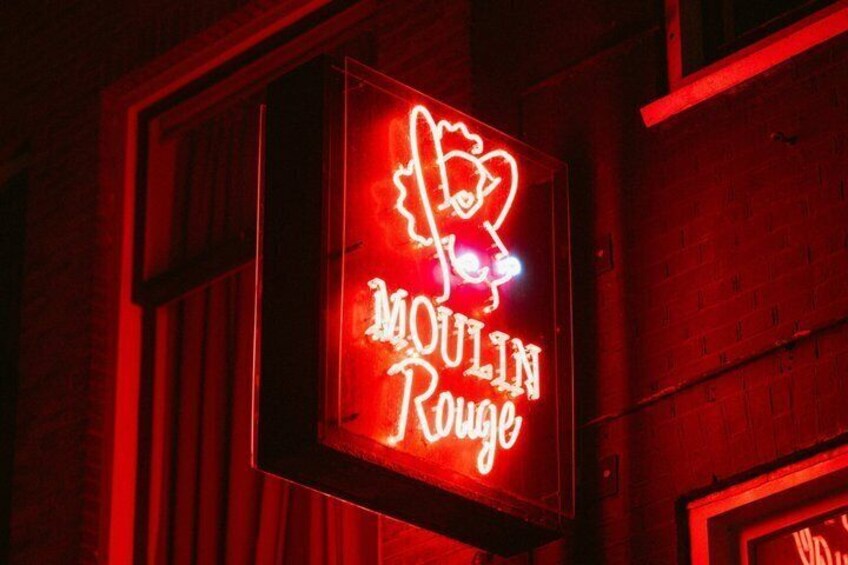 A neon sign with the text 'Moulin Rouge.' 4