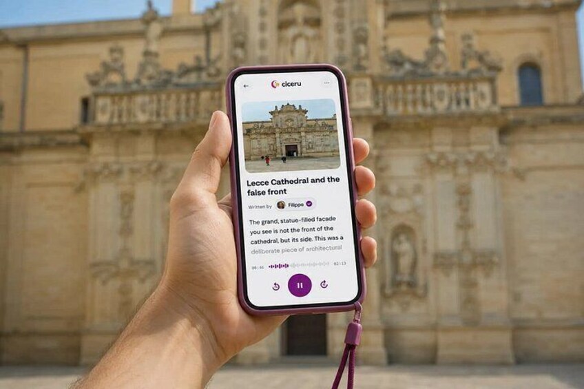 A hand holding a smartphone displaying a photo of a cathedral with a caption about the false front. 1