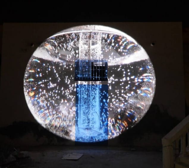 A spherical projection with a vertical blue light source. 5