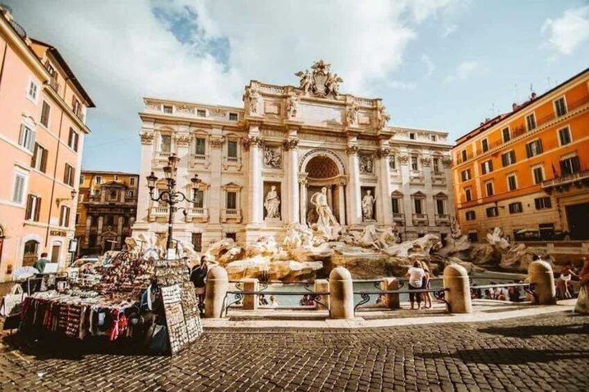 The Trevi Fountain with a market stall in the foreground. 2