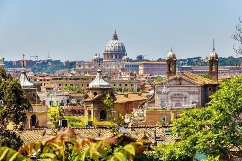 A cityscape with prominent domed buildings and bell towers, likely a historic European city. 3