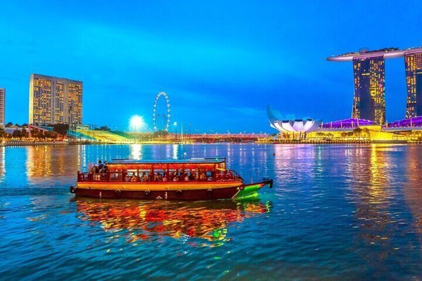 A boat on water with a city skyline in the background, including a Ferris wheel and modern buildings. 2