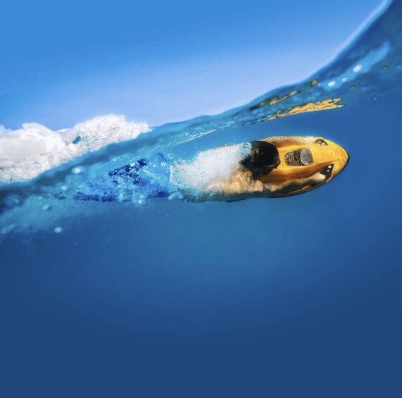 A person surfing a wave in the ocean. 3