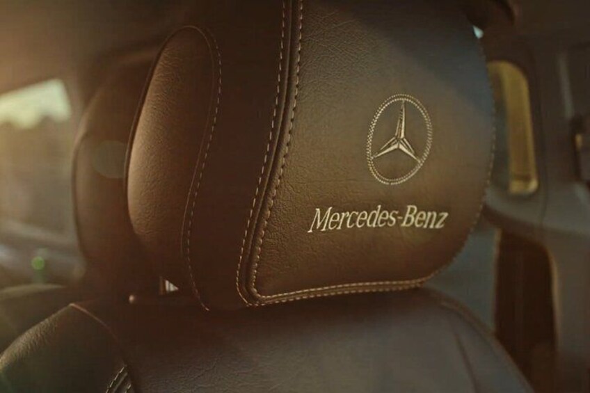 A leather car interior with the Mercedes-Benz logo. 3
