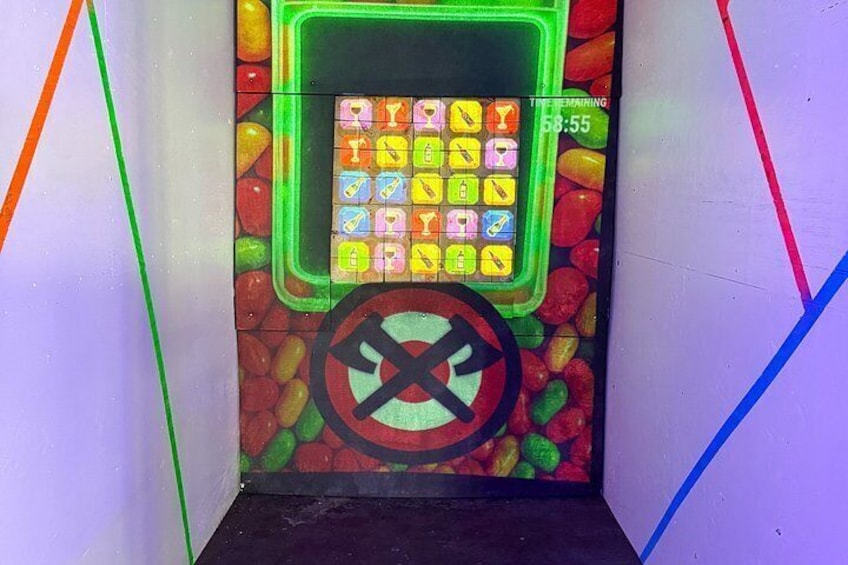 A colorful candy-themed escape room with a timer and a prohibition sign. 1