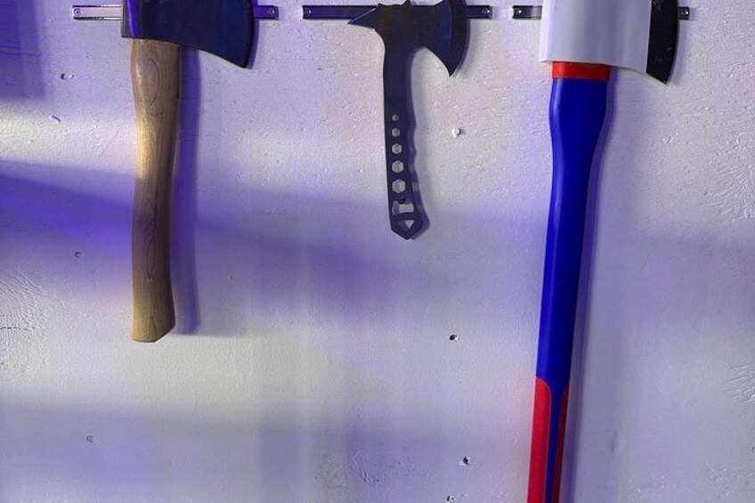 Three axes hanging on a wall. 5