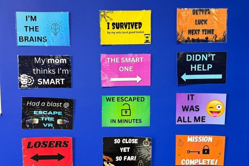 A collection of colorful signs with various messages and symbols. 2