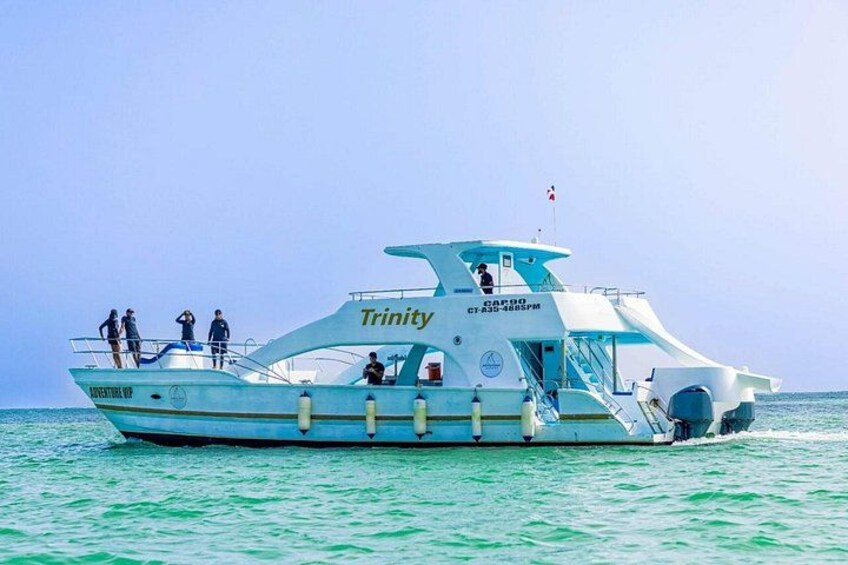 A boat named Trinity on calm waters. 2