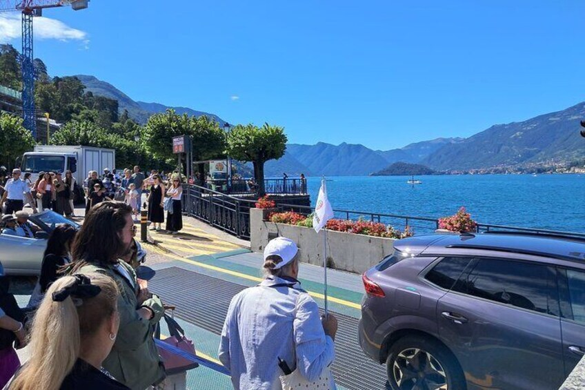 A ferry with passengers, a mountainous landscape, and a body of water. 4