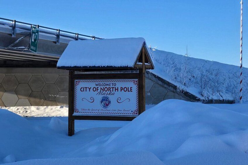 A sign in the snow welcoming visitors to the City of North Pole, Alaska. 5