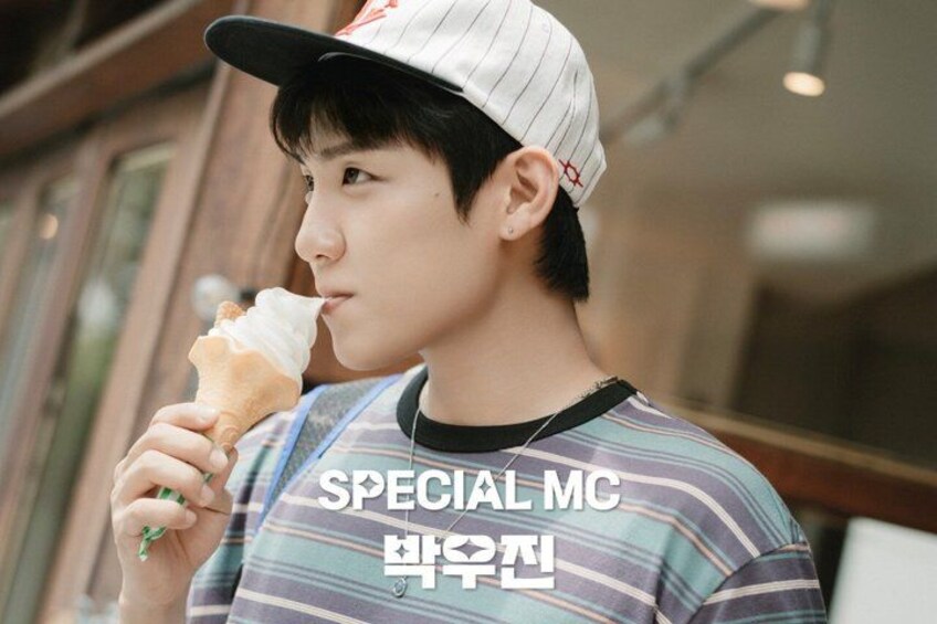 A person wearing a striped shirt and a cap, holding an ice cream cone. 2