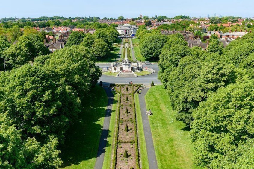 A park with a central fountain, surrounded by trees and pathways. 4