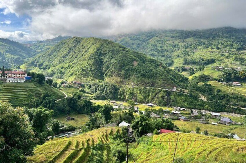 Terraced fields, a village, and mountains. 4