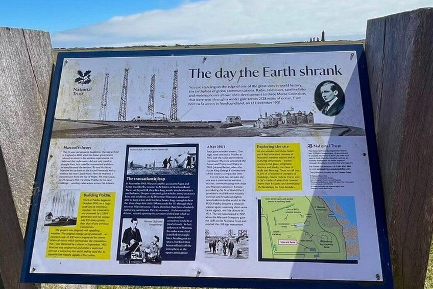 A historical information board titled 'The day the Earth shrank' with text and images about the event. 2
