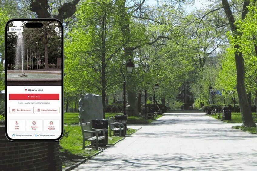 A park pathway lined with trees and benches, a fountain, and a smartphone displaying a map. 1