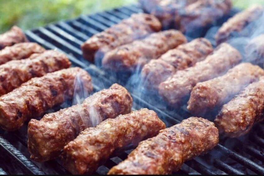 Sausages being grilled on a barbecue. 5