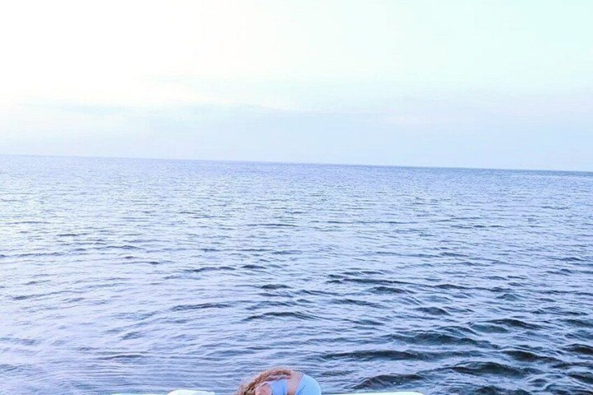 A body of water with a person in the foreground. 2