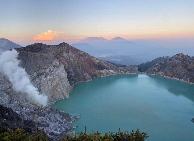 A volcanic crater lake surrounded by rugged mountains. 1